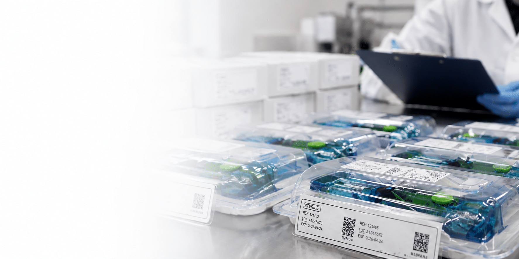 Medical device packaging and sterile packaging inspection with labeled sterile trays in a controlled manufacturing environment.